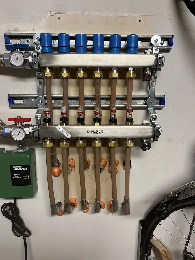 Plumber performing Water Heater Repair at a residential property in Jenks